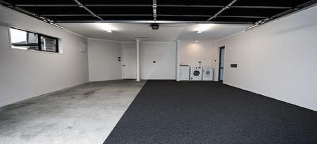 before and after photo of garage carpet