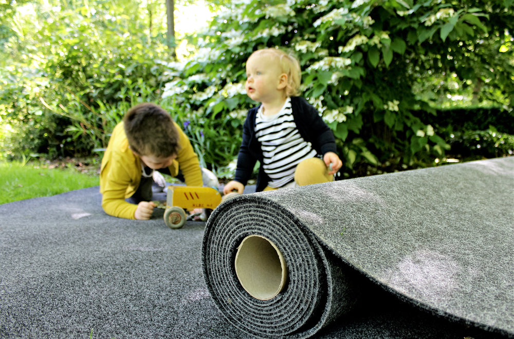 babys playing on garage carpet