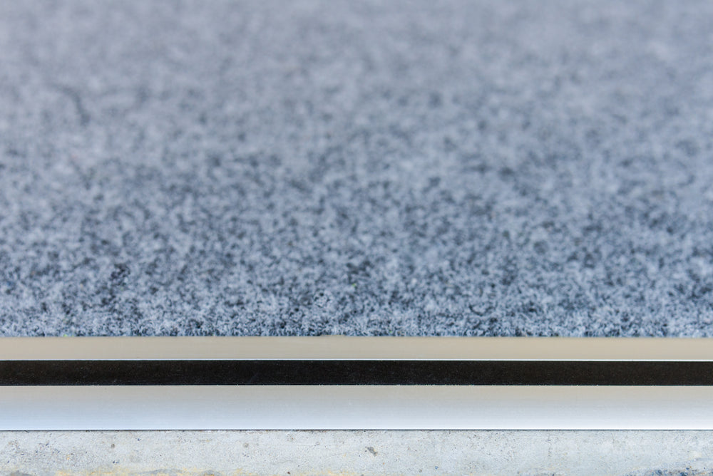 Aluminium edging protecting the front edge of garage carpet