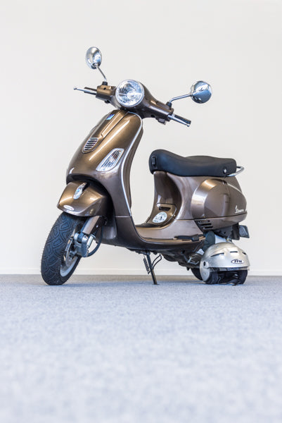 scooter & helmet on garage carpet