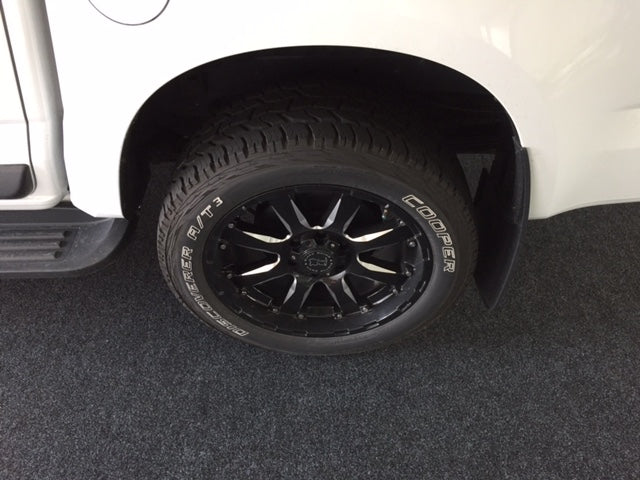 Ford Ranger wheel on charocal garage carpet