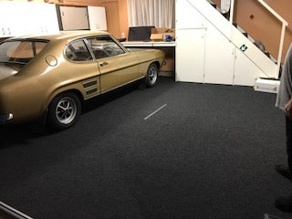 classic car on garage carpet