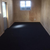 plywood walls with garage carpet in a single garage