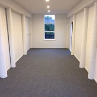 light grey garage carpet laid in a long single garage