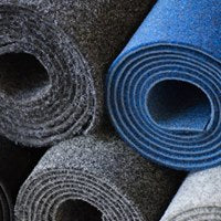 garage carpet rolls stacked