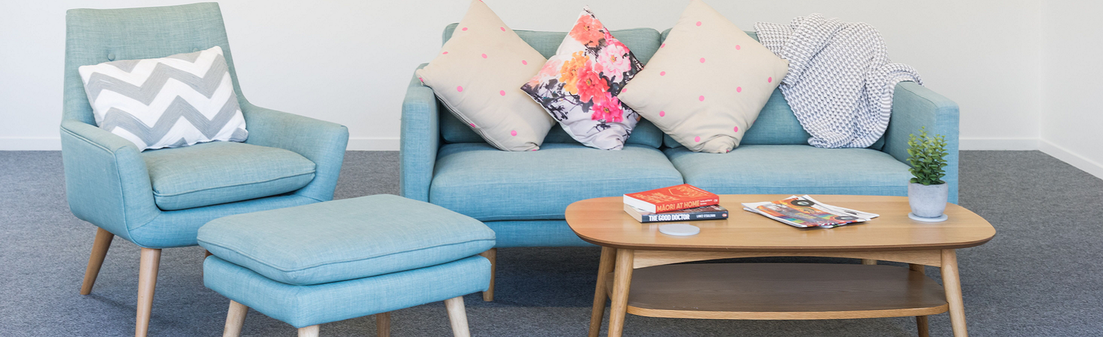 lounge set up in the garage on top of garage carpet