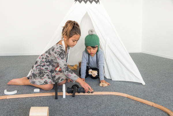 children playing in garage on garage carpet
