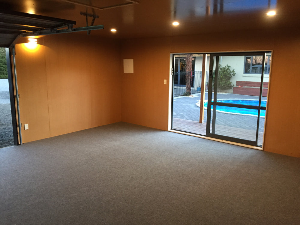 Pool house carpeted in light grey garage carpet