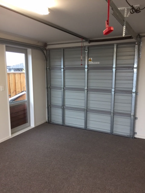 Light brown garage carpet installed in a single garage