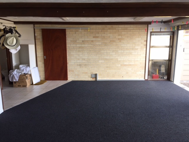 garage carpet with bricks on the wall