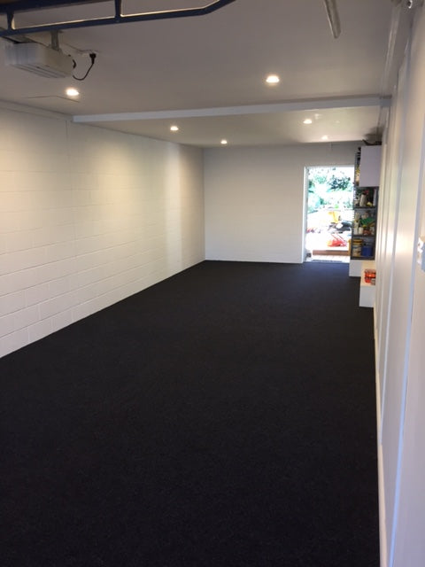 long garage with garage carpet on the floor